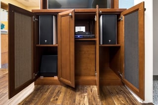 Custom components storage in a Media Center by Valet Custom Cabinets & Closets