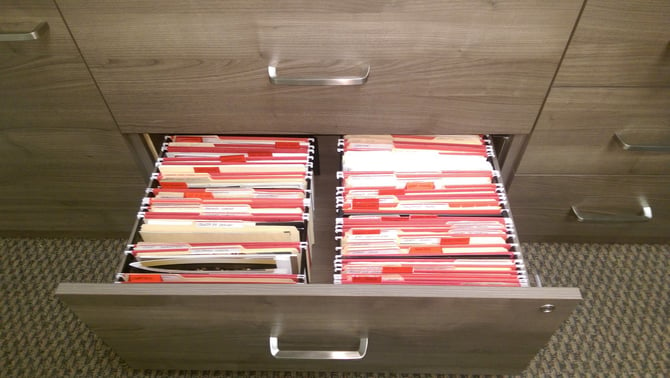 Still using file cabinets? Upgrade to a hidden double-file drawer instead to house all of your important documents.
