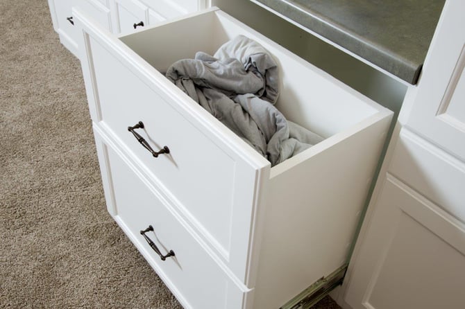 Add even more storage opportunities to your custom cabinetry (like a hamper drawer).