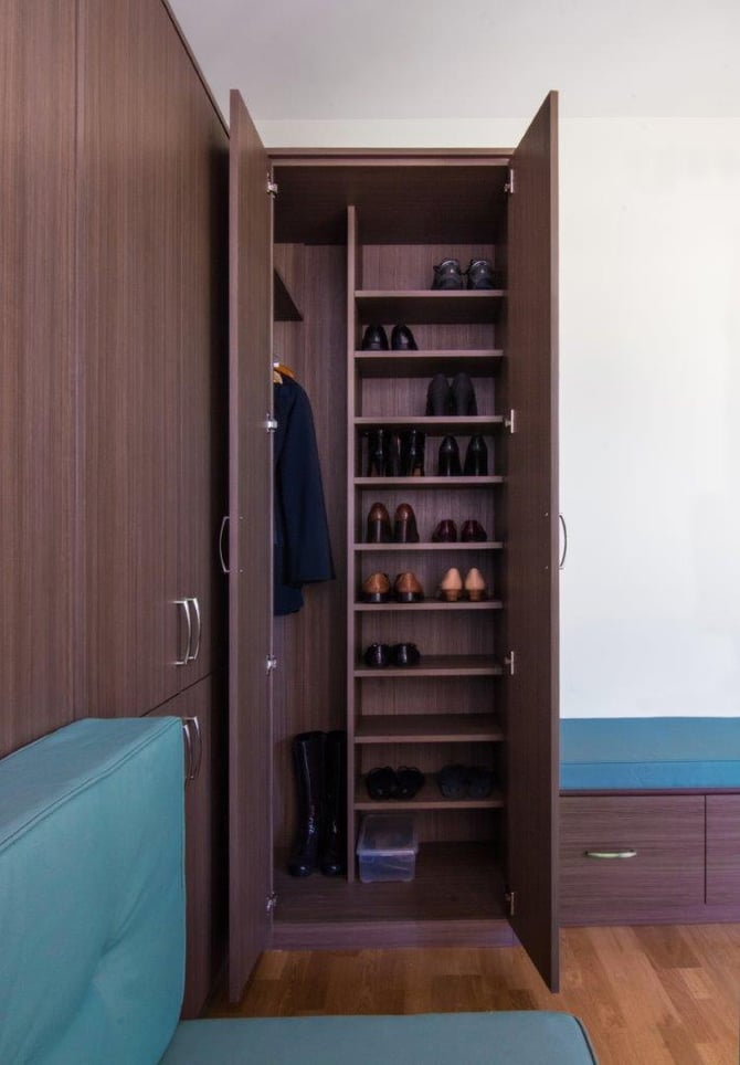 A corner wardrobe is a perfect place to stash your guests’ many, many shoes. 