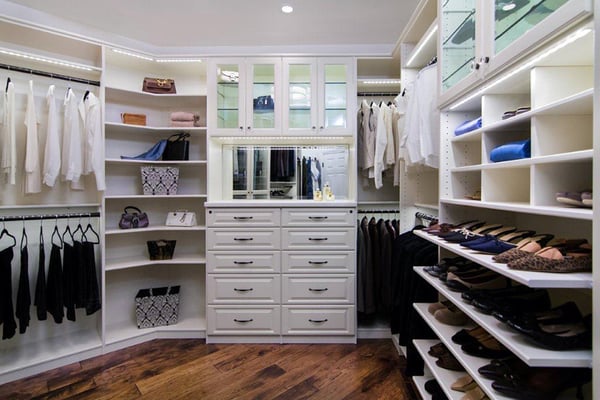 Deluxe Walk-in Closet by Valet Custom Cabinets & Closets