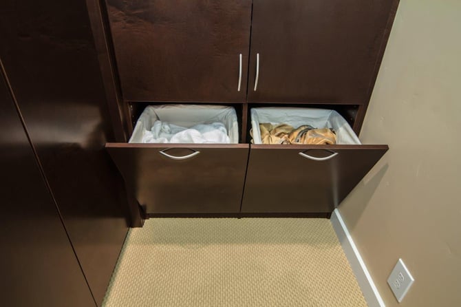 A flip-down hamper keeps the floor clean.