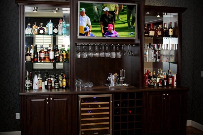  Make your entertainment center even more entertaining by adding wine storage.