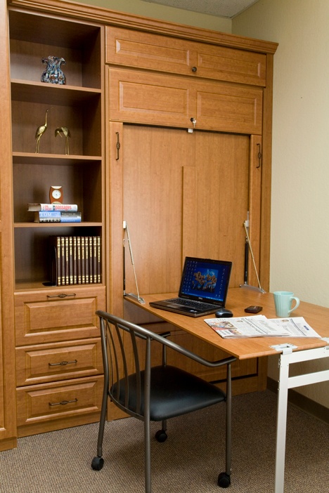 Adding a wall bed table creates another added work surface in a bedroom.